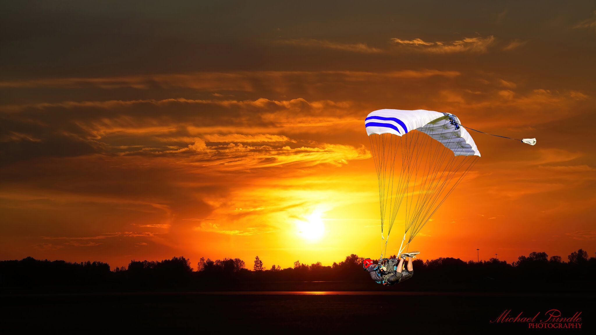 DSC15712 Skydiver landing against sunset.jpg