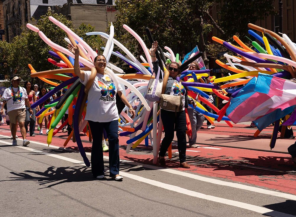 San Francisco Pride Parade 2026 - Women with skinny balloons