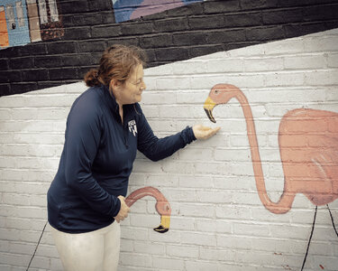 Bev feeding Flamingos.JPG