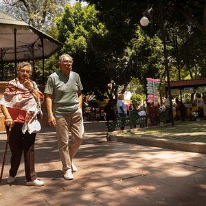 Old Couple walking in the park in Puebla, Mexico