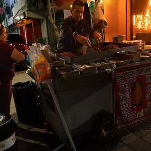 Street vender making tacos at night  in Downtown Mexico City