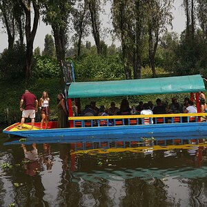 Boat and driver in Xochimilco, Mexico