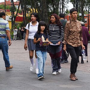 Family in the park with mother and students