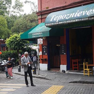Man in sport coat in front of Tepoznieves Restaurant in Mexico City