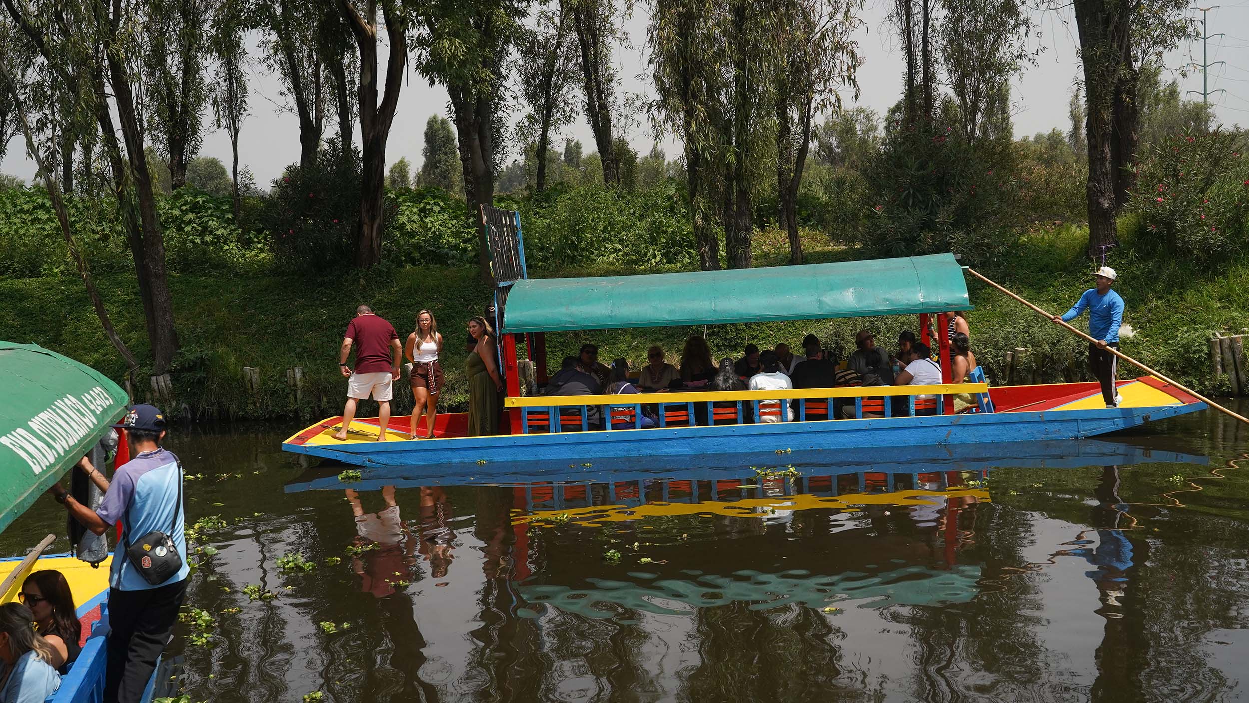 Boat and driver in Xochimilco, Mexico