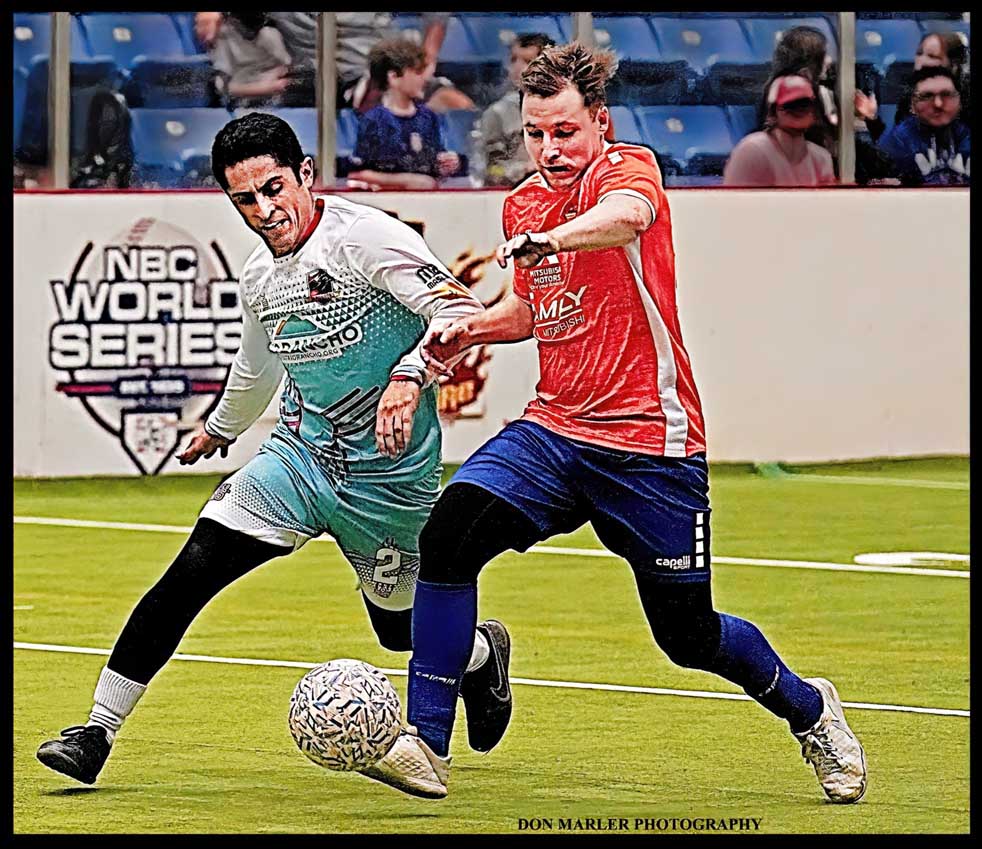 COLIN BATTLING FOR POSSESSION OF THE BALL .JPEG