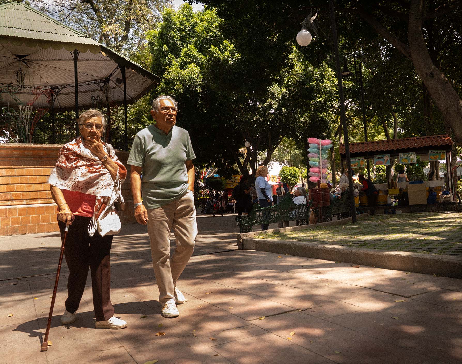 Old Couple walking in the park in Puebla, Mexico