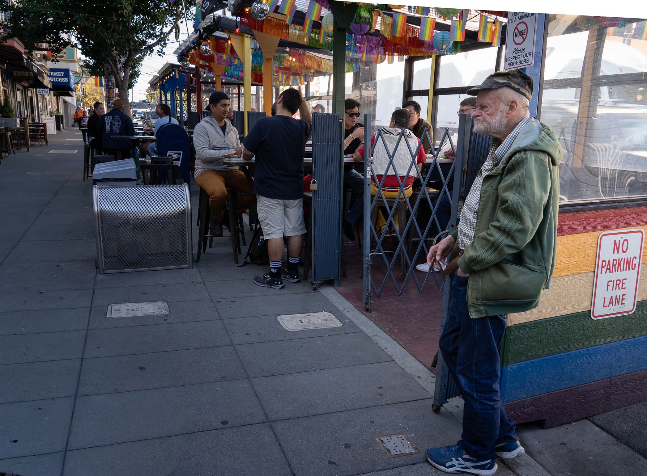 Old man outside restaurant