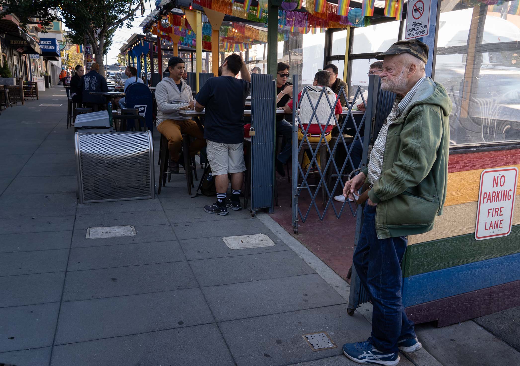 Old man outside restaurant
