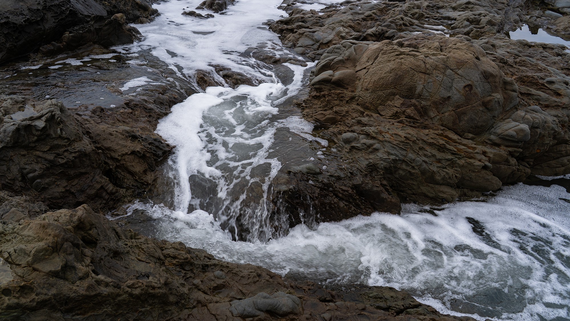 Pebble Beach-Flowing Water over the rocks