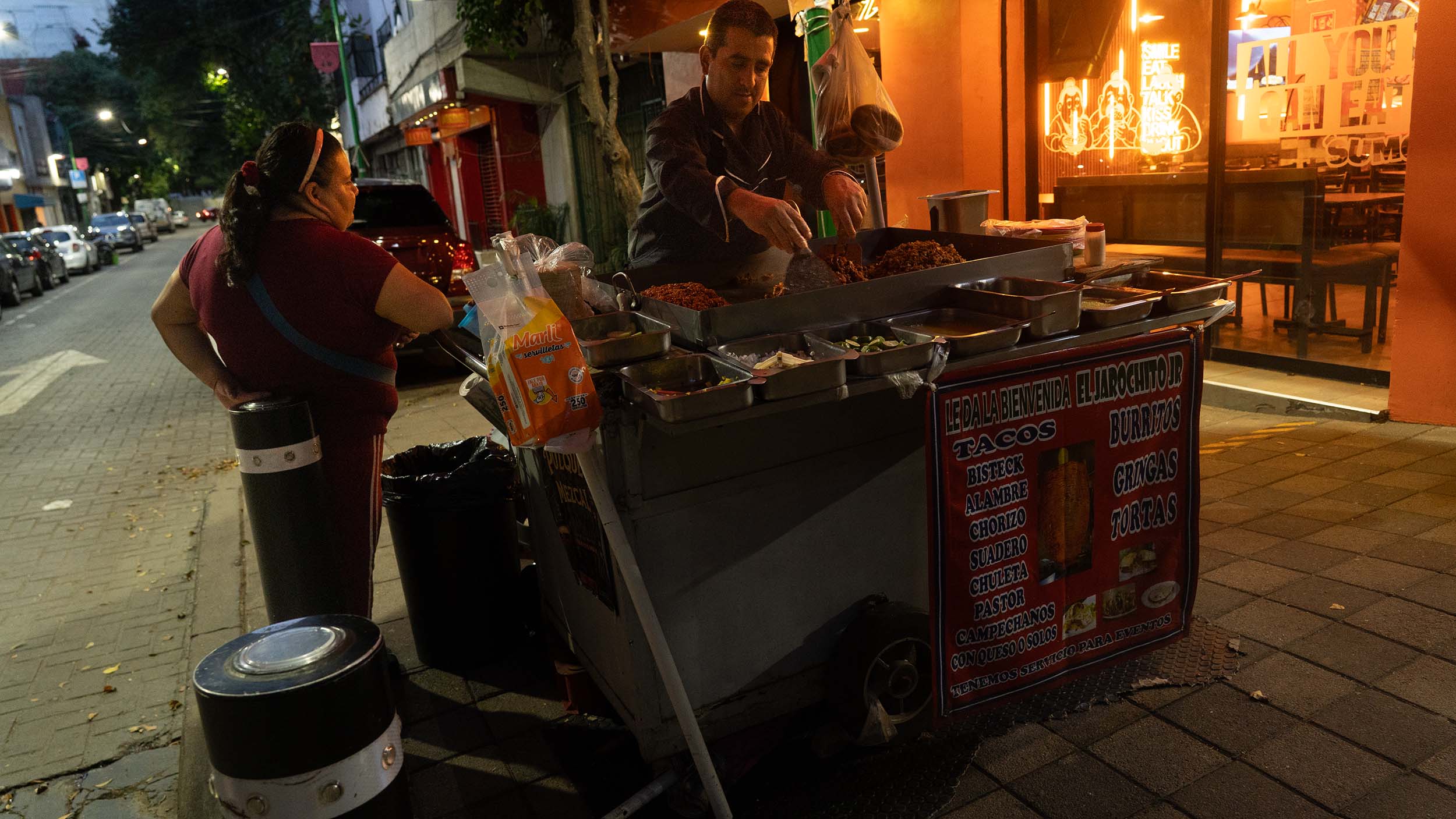 Street vender making tacos at night  in Downtown Mexico City