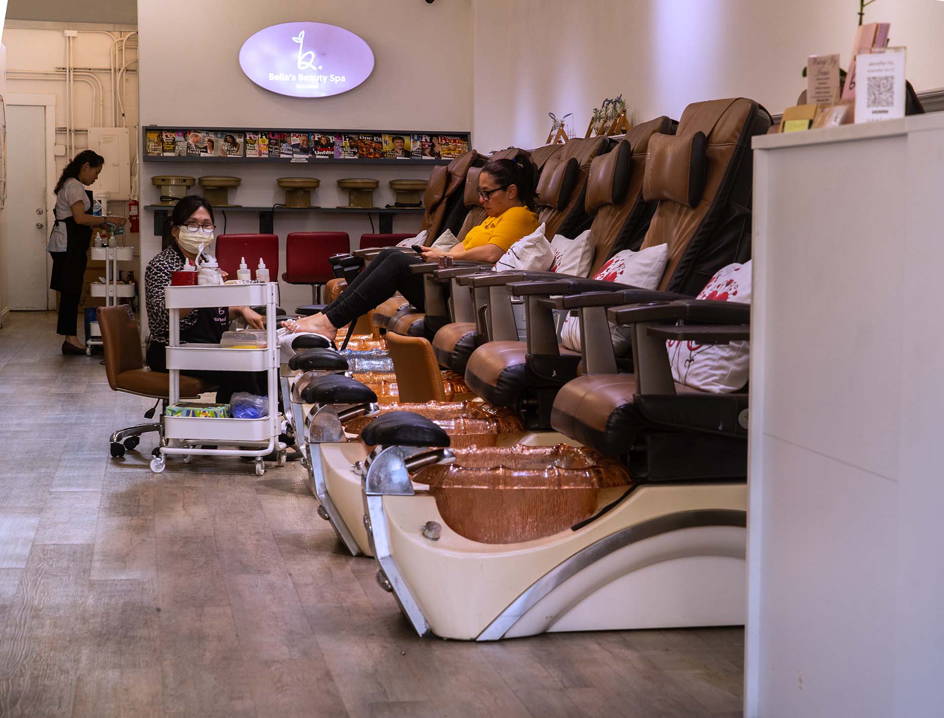 Woman getting her toes done on Broadway Street in Burlingame, California